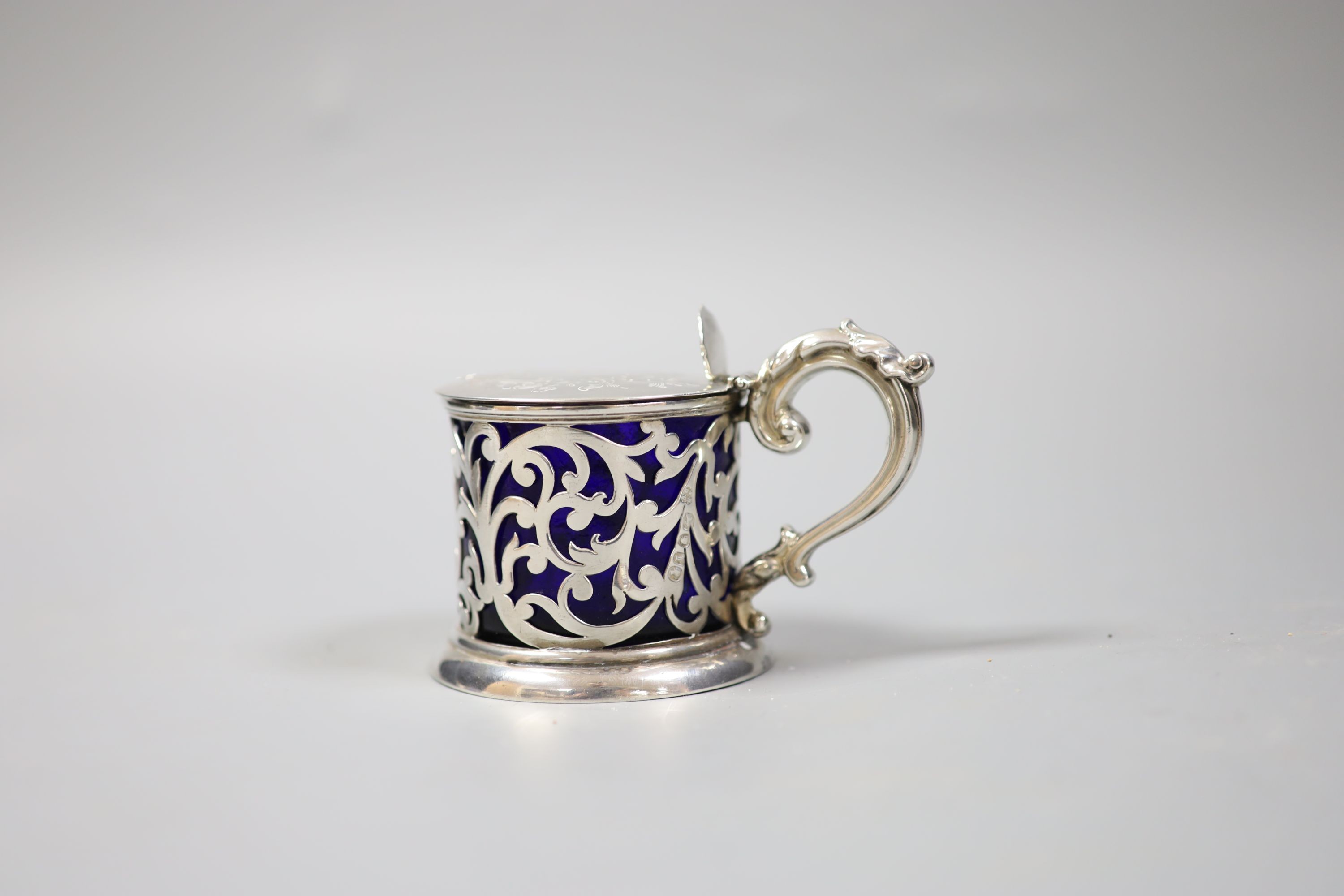 A Victorian pierced silver mustard, with blue glass liner, London, 1846, 75mm.